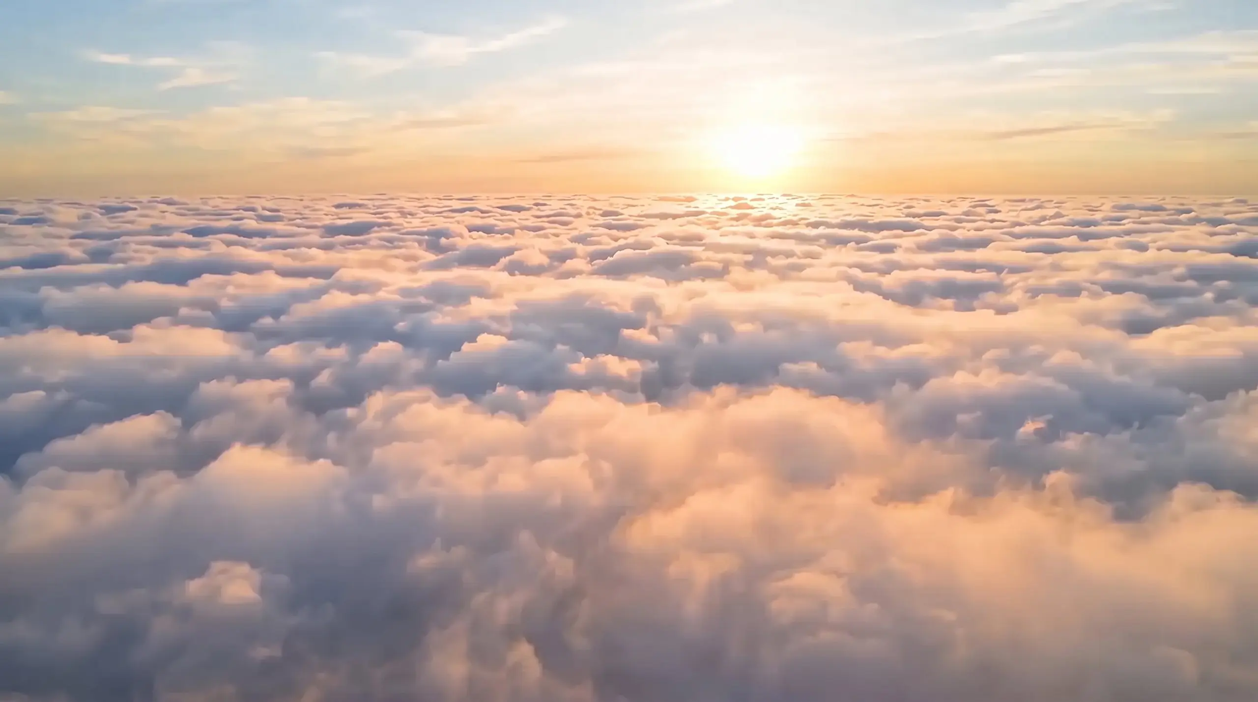 A sea of clouds at sundown, seen from above